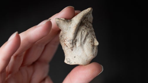 A Roman pipeclay head of the god Mercury, found at Smallhythe Place, Kent